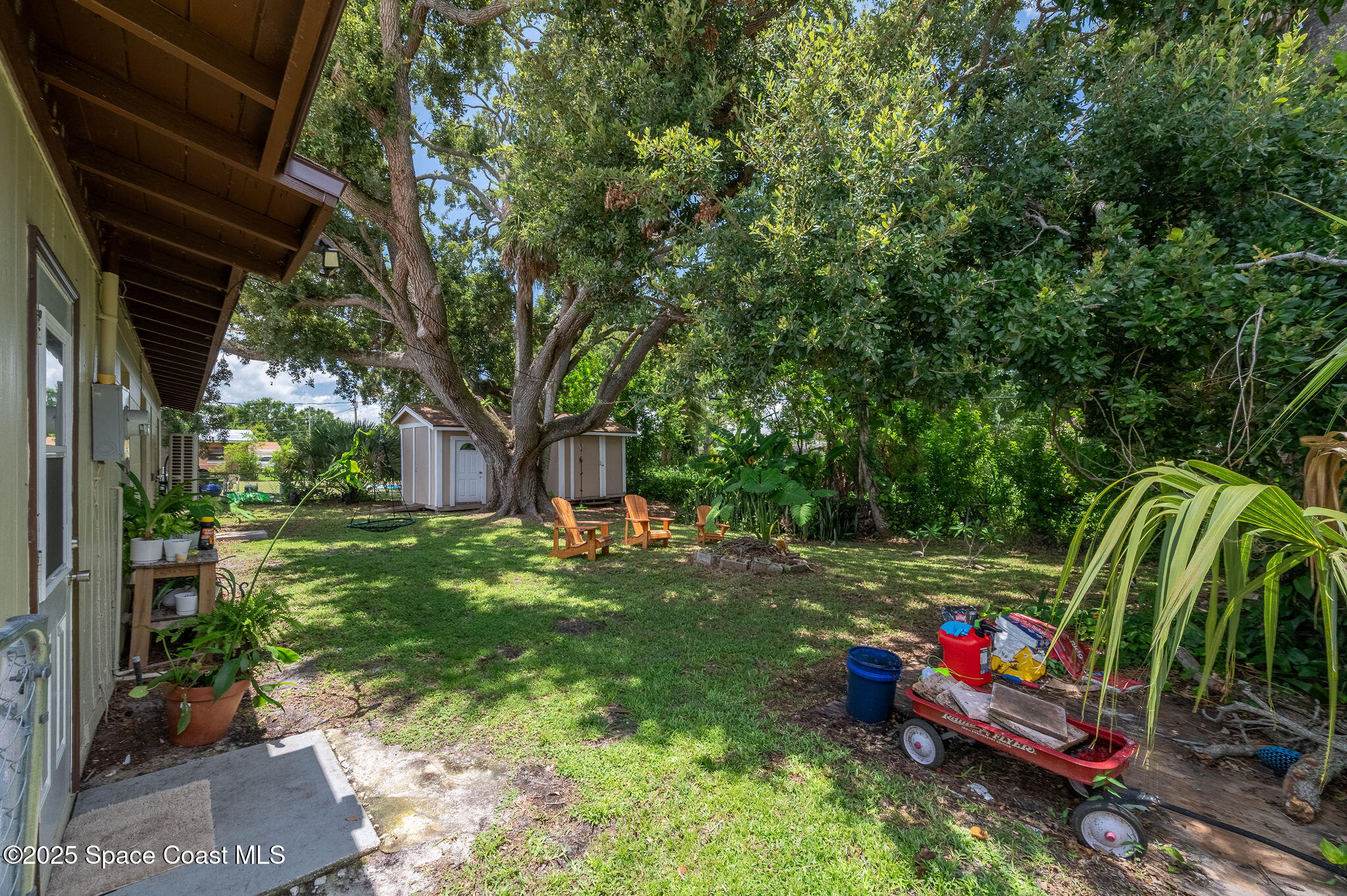 369 Western Avenue Cocoa, FL 32926 - Photo 26 of 38 a backyard of a house with seating space