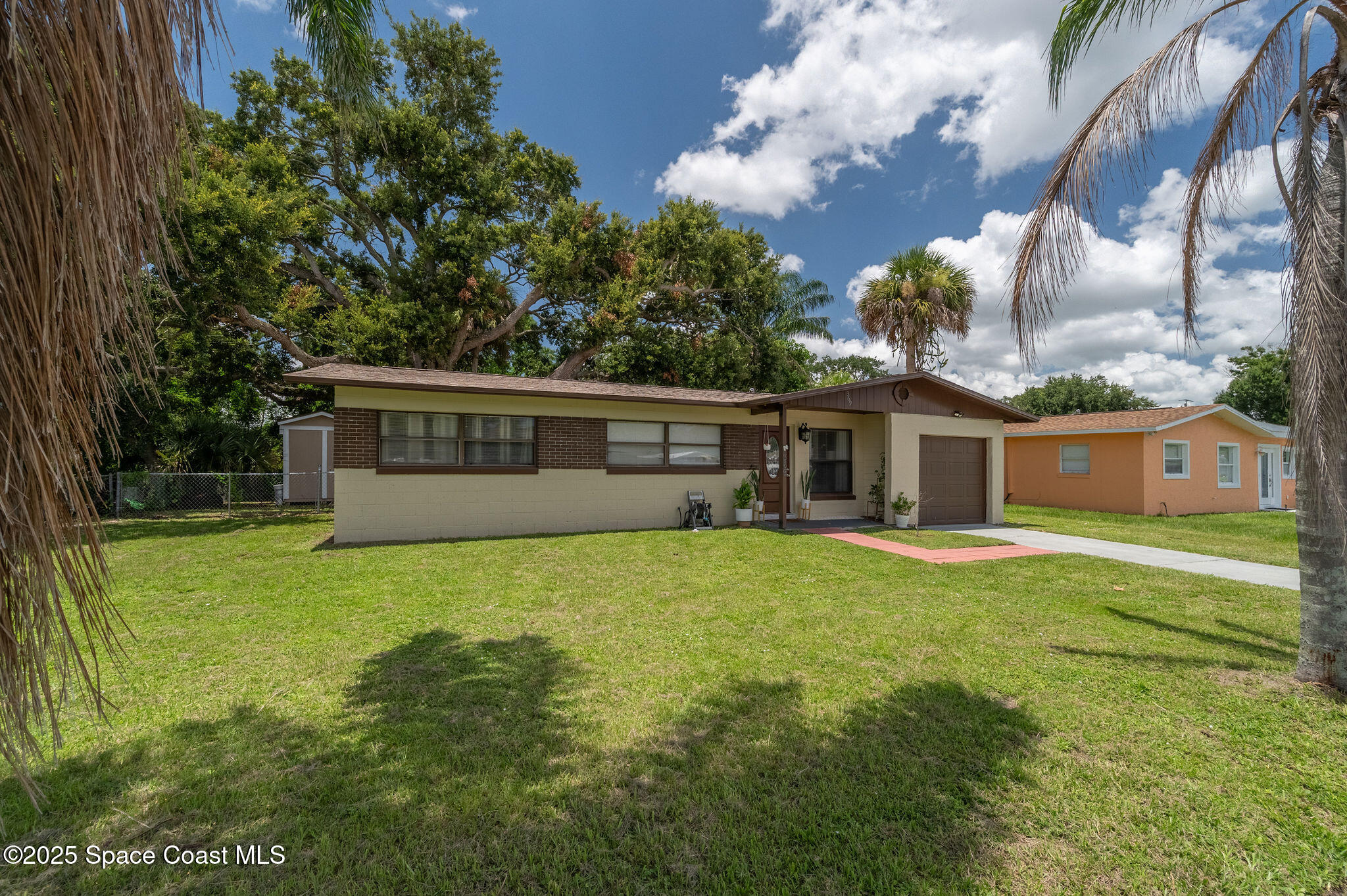 369 Western Avenue Cocoa, FL 32926 - Photo 34 of 38 a front view of a house with a garden