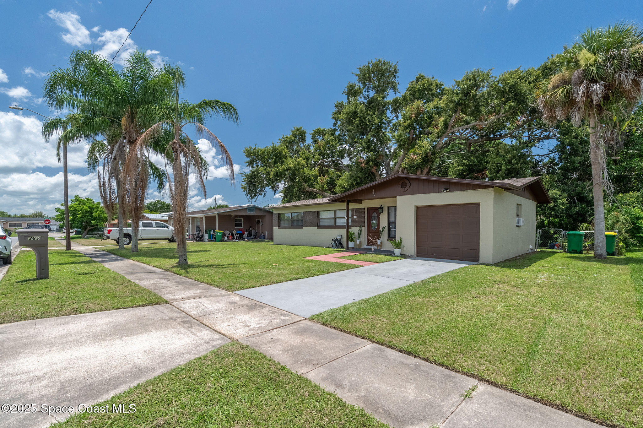 369 Western Avenue Cocoa, FL 32926 - Photo 35 of 38 a front view of house with yard and green space
