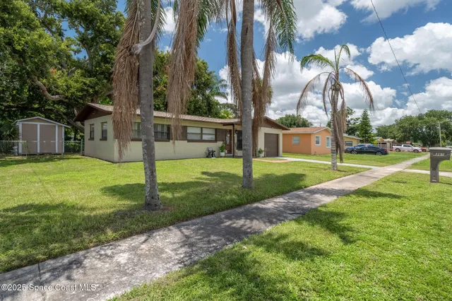 a view of a park with swings and slides