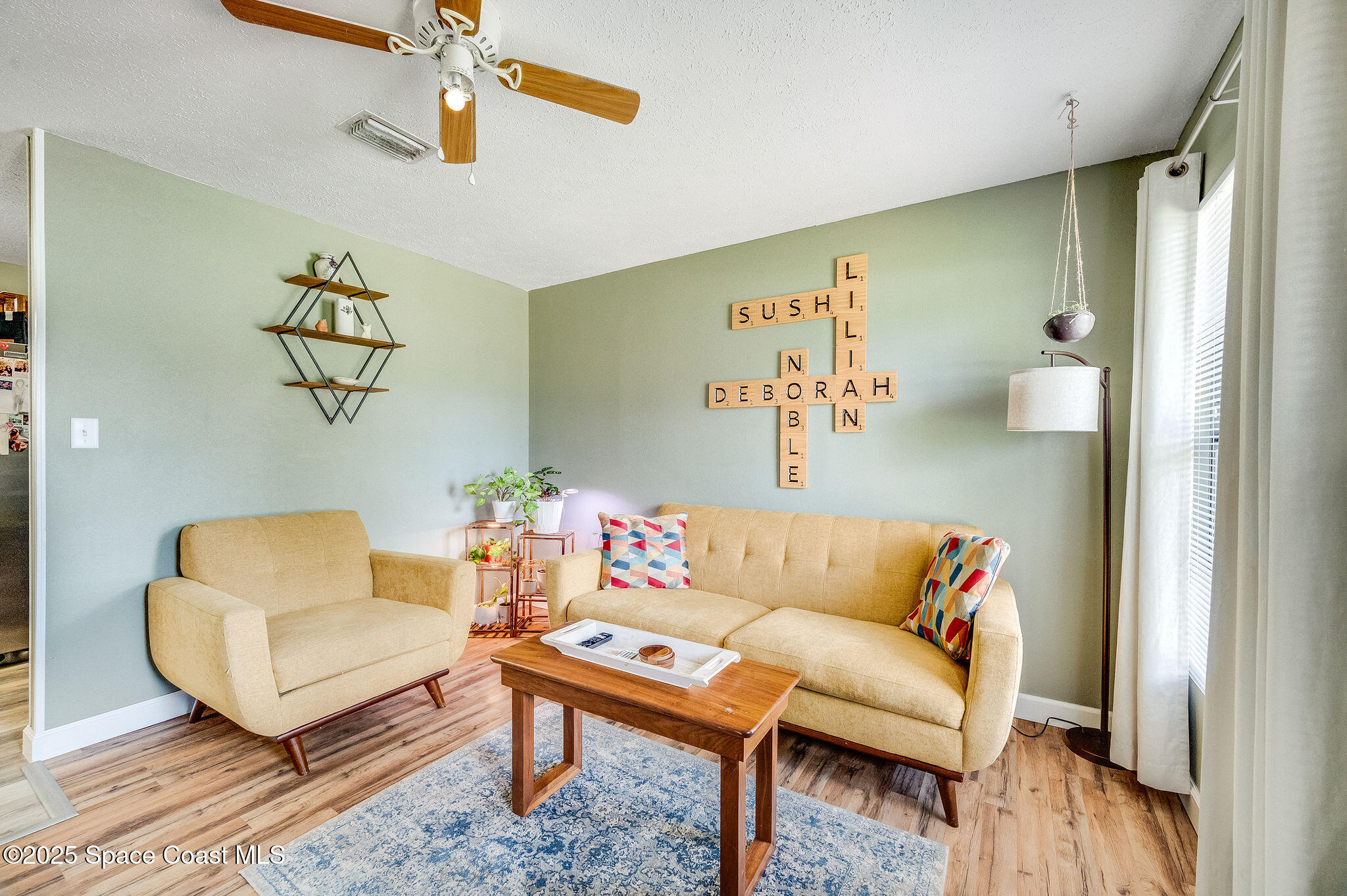 369 Western Avenue Cocoa, FL 32926 - Photo 4 of 38 a living room with furniture and wooden floor