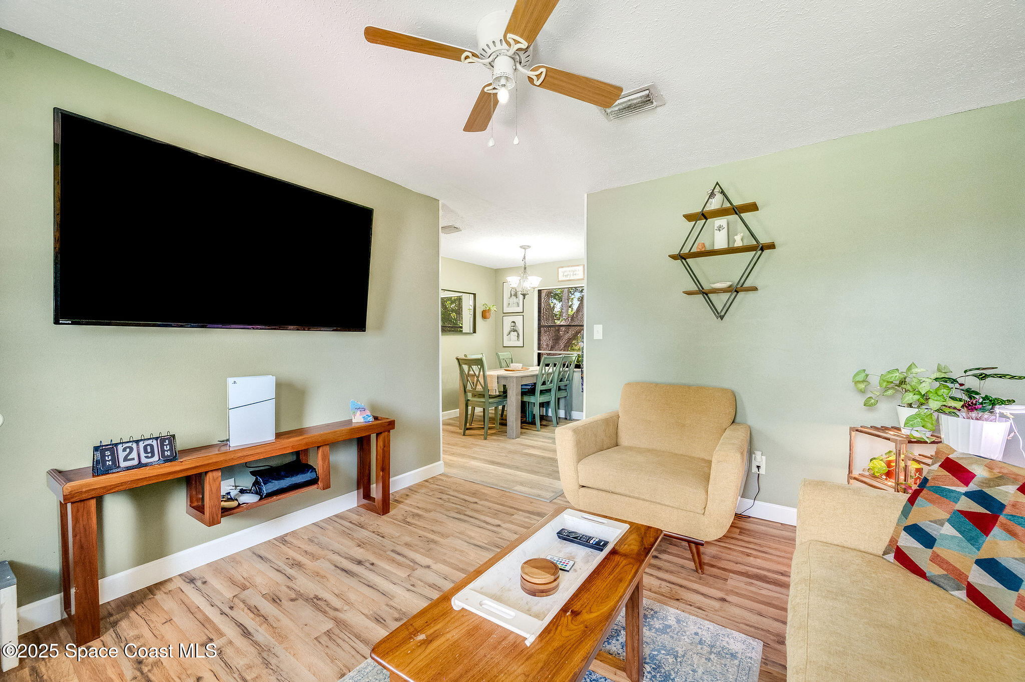 369 Western Avenue Cocoa, FL 32926 - Photo 5 of 38 a living room with furniture and a flat screen tv