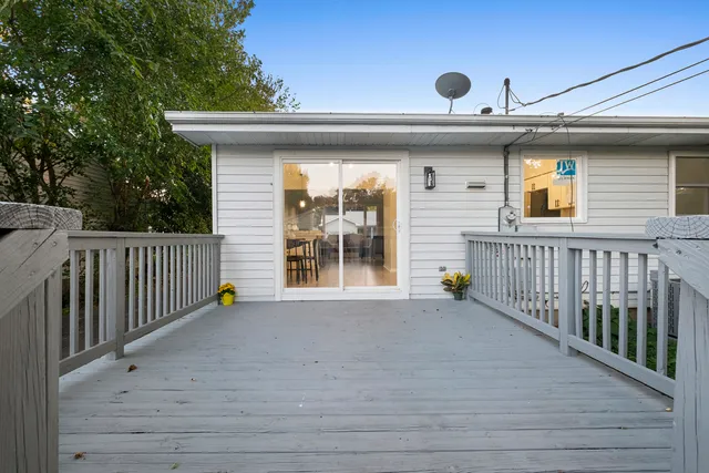 a view of a deck with a wooden fence