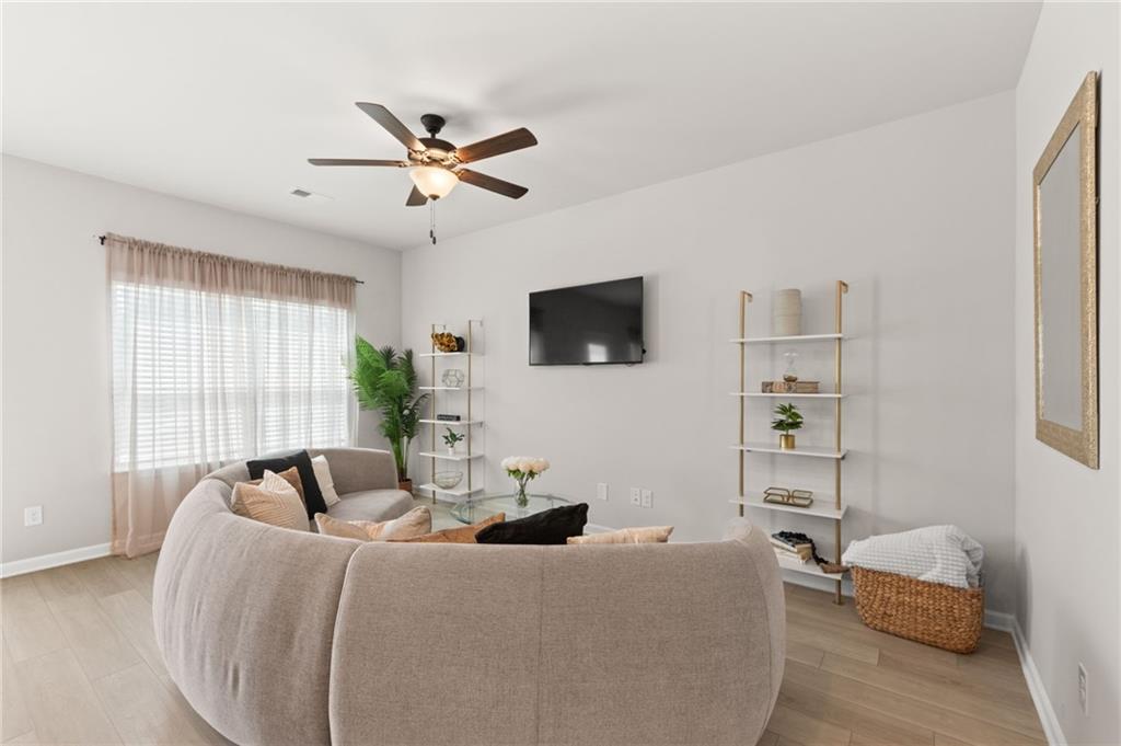 2538 Polaris Way Southwest Atlanta, GA 30331 - Photo 14 of 28 a living room with furniture and a flat screen tv