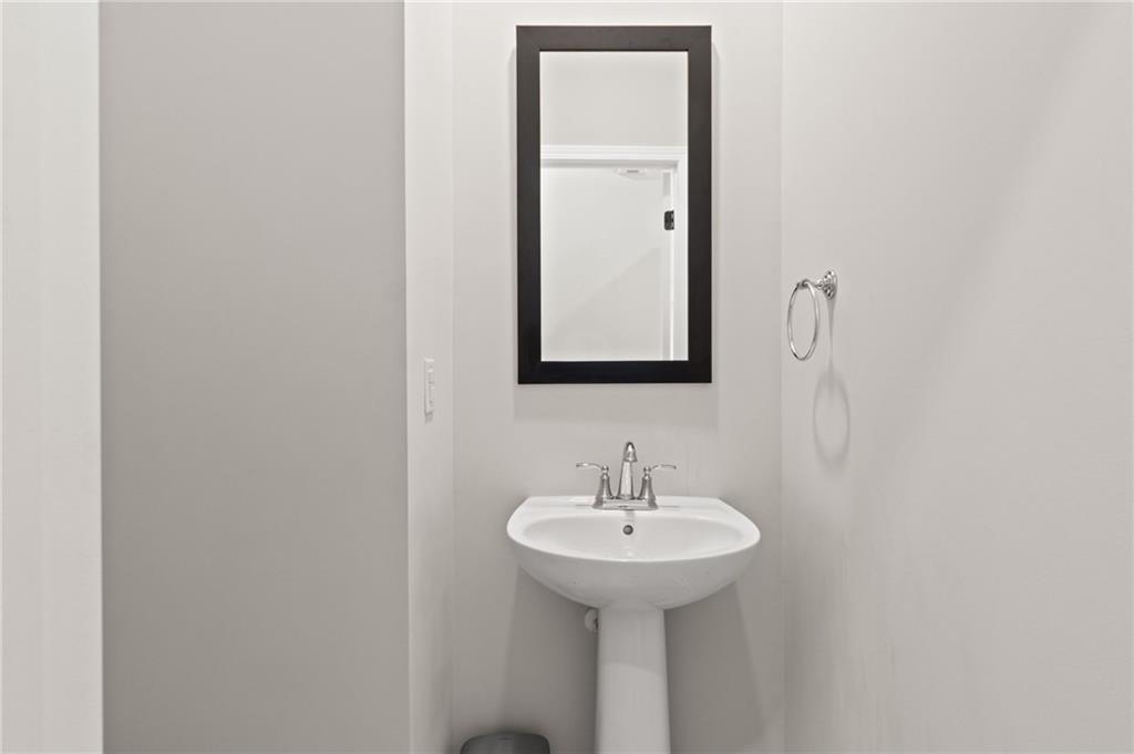 2538 Polaris Way Southwest Atlanta, GA 30331 - Photo 15 of 28 a bathroom with a sink and mirror