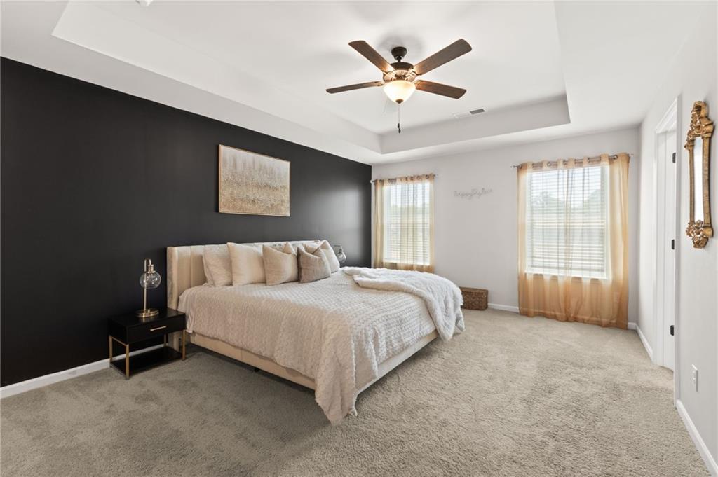 2538 Polaris Way Southwest Atlanta, GA 30331 - Photo 16 of 28 a spacious bedroom with a bed and a ceiling fan