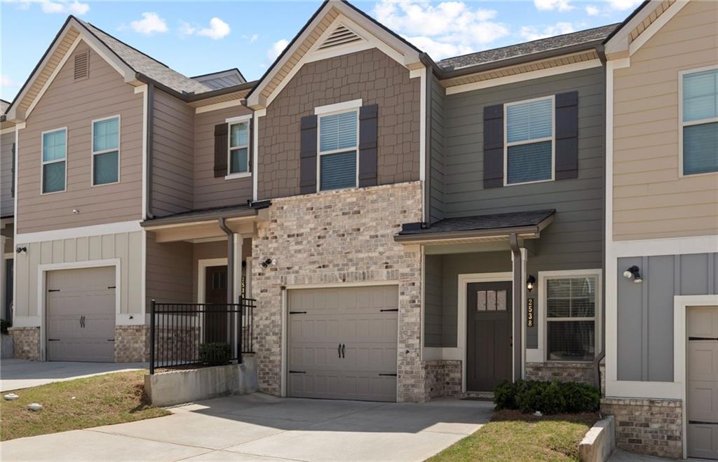 2538 Polaris Way Southwest Atlanta, GA 30331 - Photo 2 of 28 a front view of a house with a yard