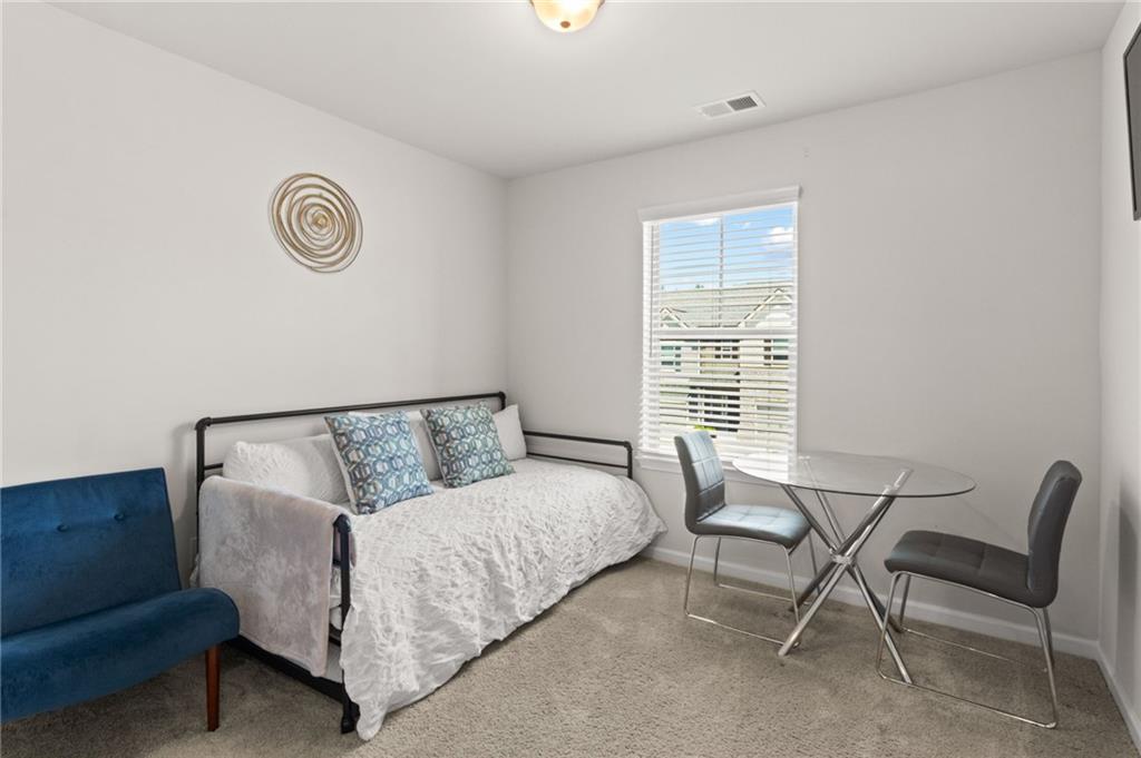 2538 Polaris Way Southwest Atlanta, GA 30331 - Photo 21 of 28 a bed room with a bed and a chair