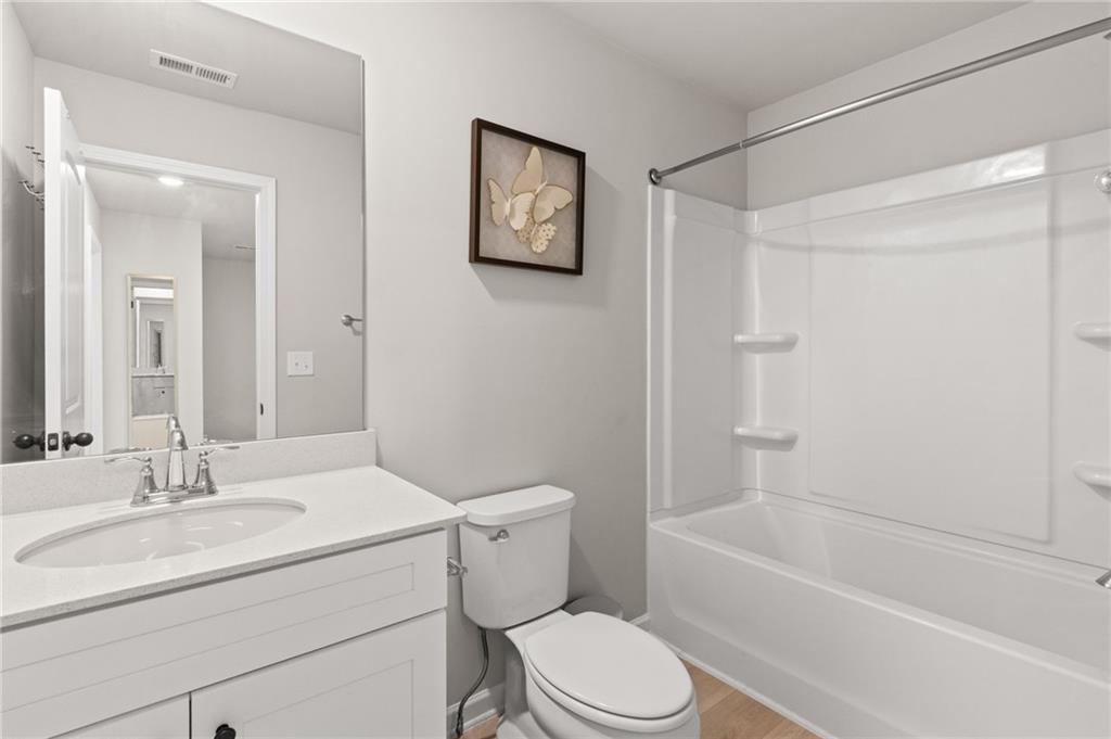 2538 Polaris Way Southwest Atlanta, GA 30331 - Photo 23 of 28 a bathroom with a sink toilet and a bathtub