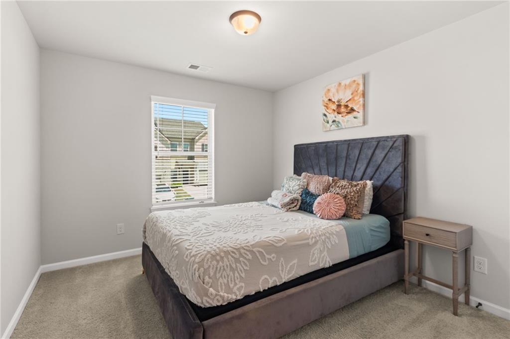 2538 Polaris Way Southwest Atlanta, GA 30331 - Photo 24 of 28 a bedroom with a bed and a window