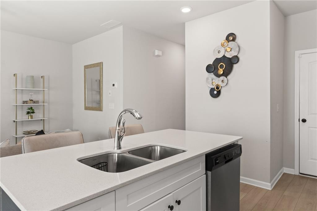 2538 Polaris Way Southwest Atlanta, GA 30331 - Photo 9 of 28 a kitchen with a sink and a refrigerator