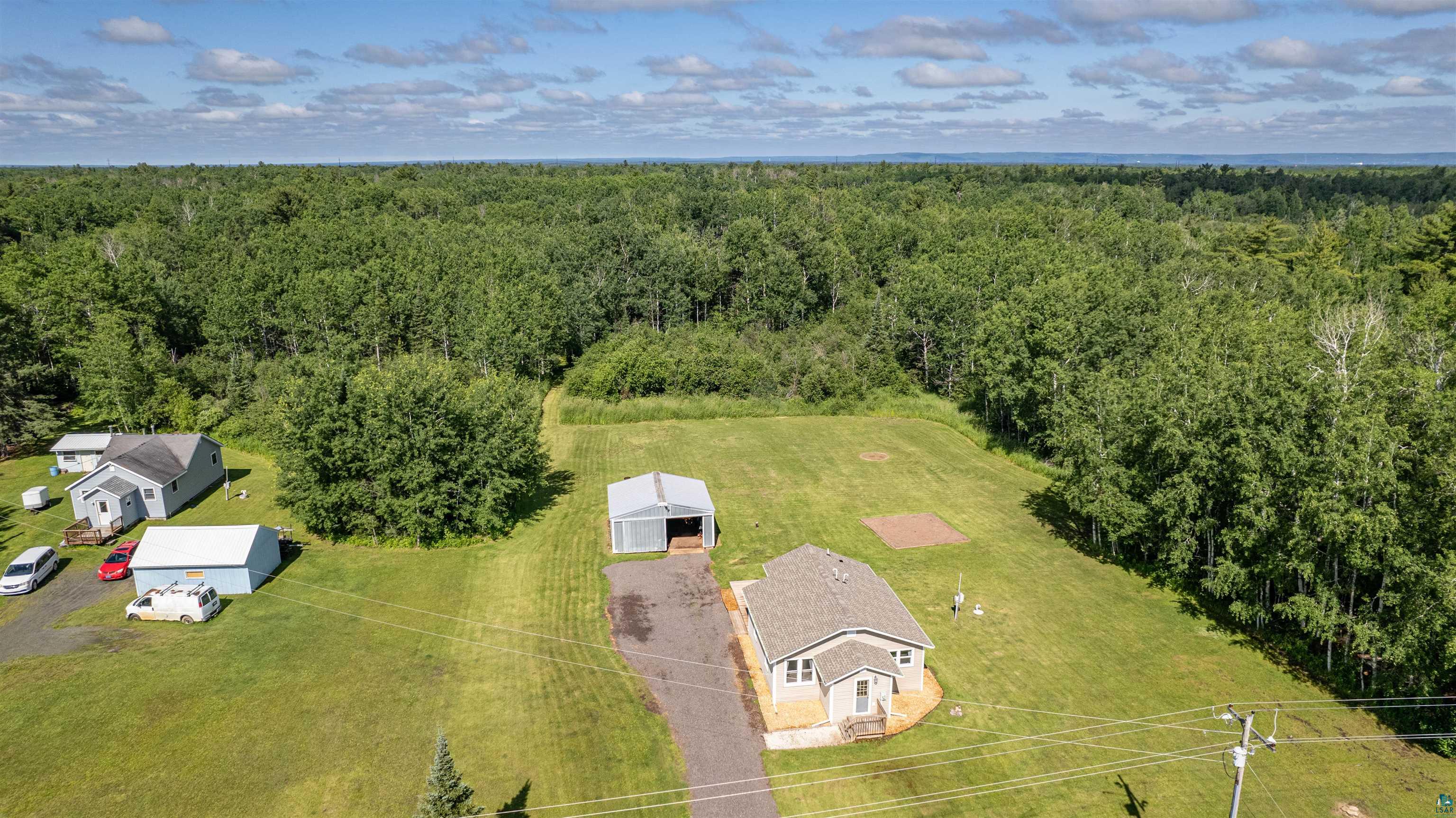 3835 South County Rd K South Range, WI 54874 - Photo 24 of 29 Spacious property featuring a single-story residence with light-colored siding and a gray shingle roof