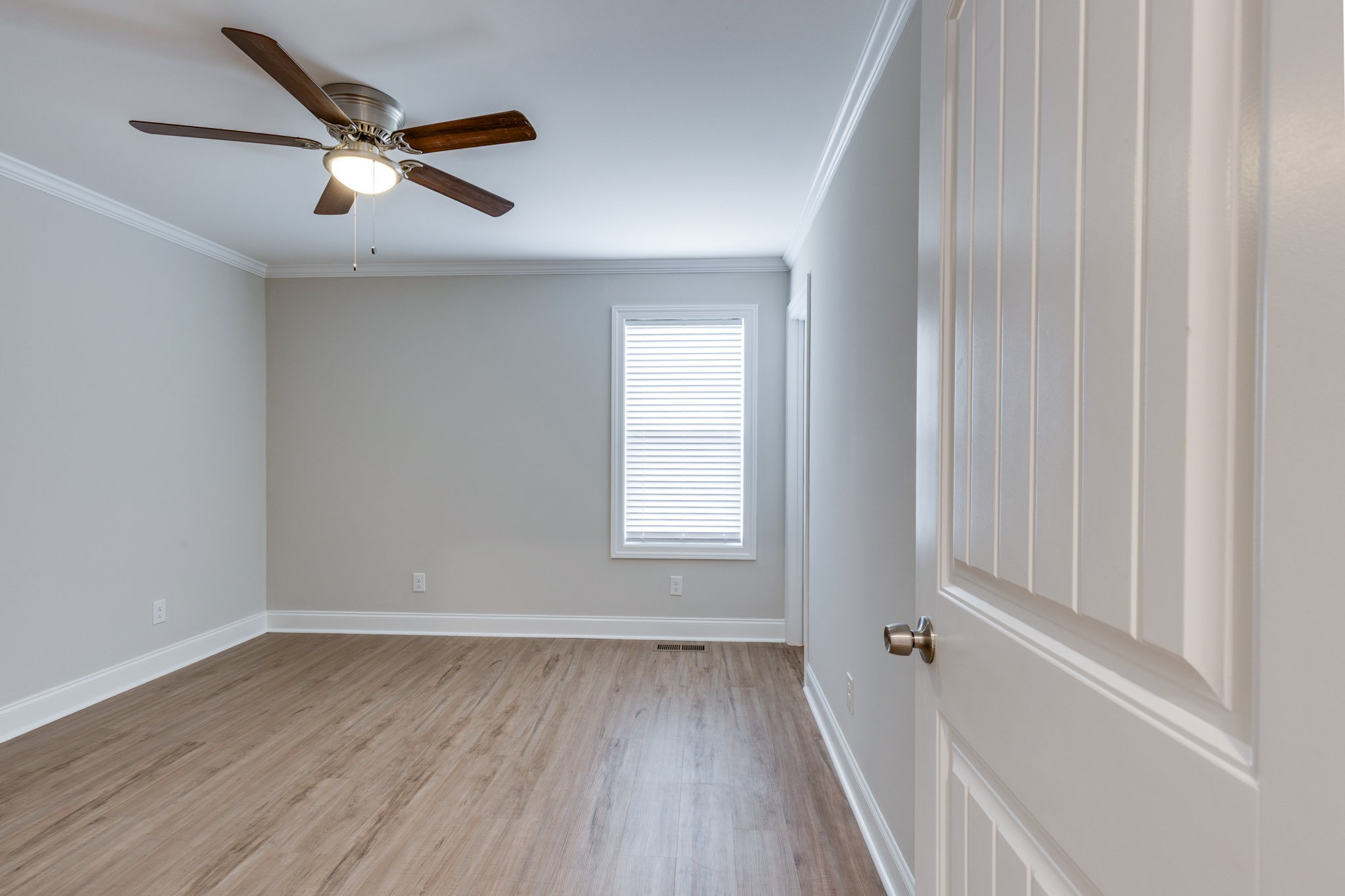 122 Fiddlers Court Pulaski, TN 38478 - Photo 19 of 27 a view of a livingroom with a hardwood floor and a ceiling fan