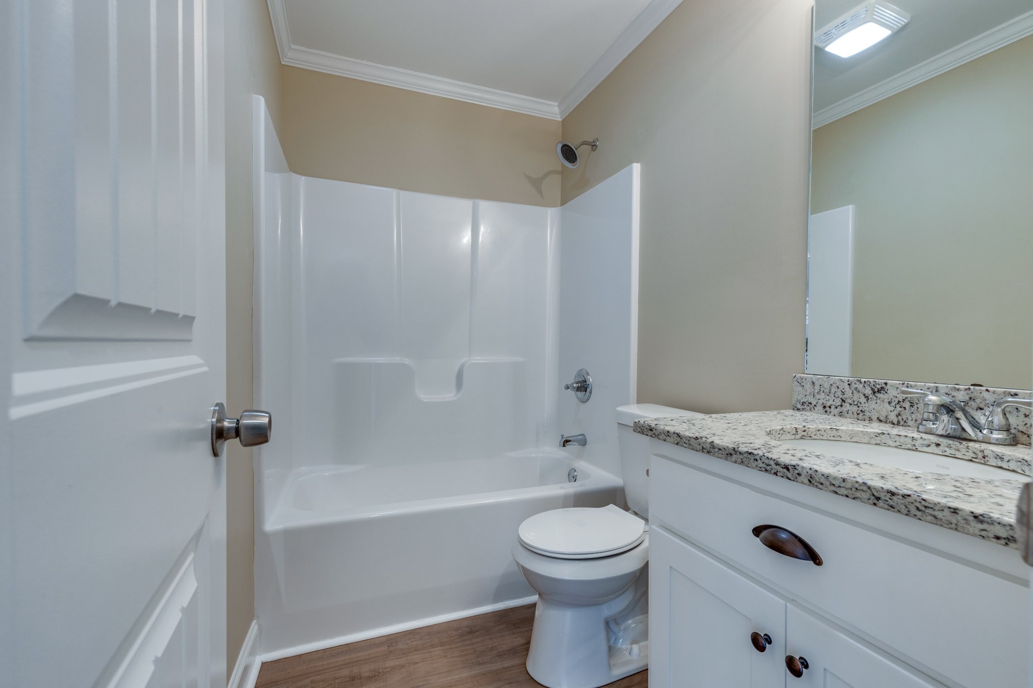 122 Fiddlers Court Pulaski, TN 38478 - Photo 23 of 27 a bathroom with a granite countertop sink a toilet and shower