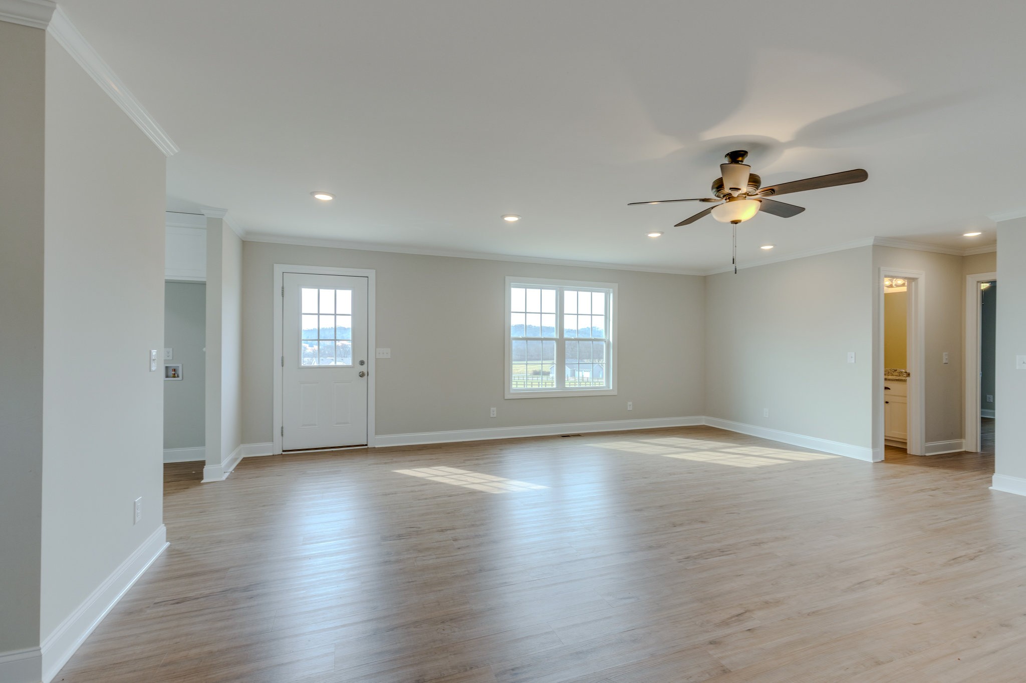 122 Fiddlers Court Pulaski, TN 38478 - Photo 8 of 27 a view of an empty room with a window and wooden floor