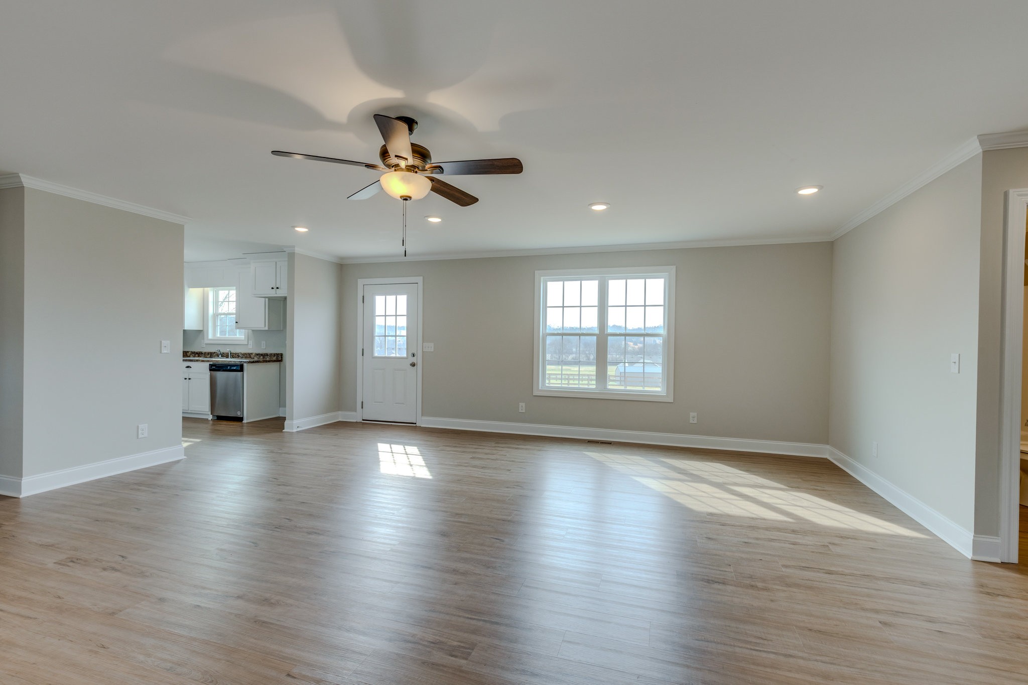 122 Fiddlers Court Pulaski, TN 38478 - Photo 9 of 27 a view of an empty room with window and wooden floor