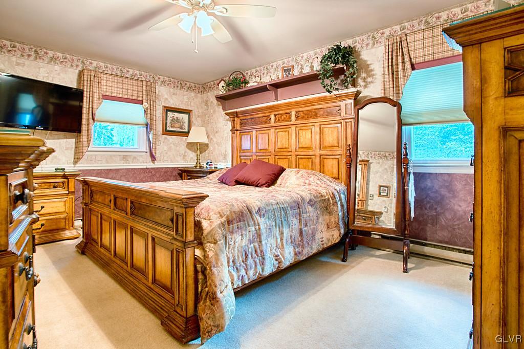 989 Park Estates Road Wind Gap, PA 18091 - Photo 11 of 41 a bedroom with a bed a flat screen tv and next to a window