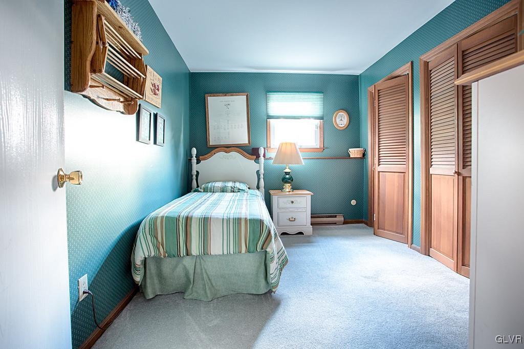 989 Park Estates Road Wind Gap, PA 18091 - Photo 36 of 41 a bedroom with a bed and a mirror