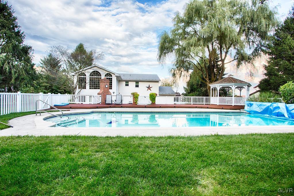 989 Park Estates Road Wind Gap, PA 18091 - Photo 40 of 41 a view of house with swimming pool and trees in the background