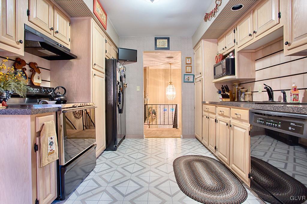 989 Park Estates Road Wind Gap, PA 18091 - Photo 7 of 41 a kitchen with stainless steel appliances granite countertop a stove a washer and dryer