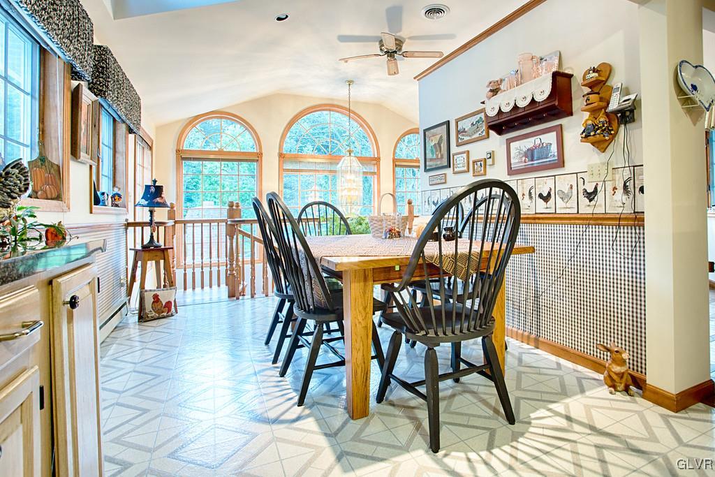 989 Park Estates Road Wind Gap, PA 18091 - Photo 8 of 41 a view of a dining room with furniture a chandelier and wooden floor