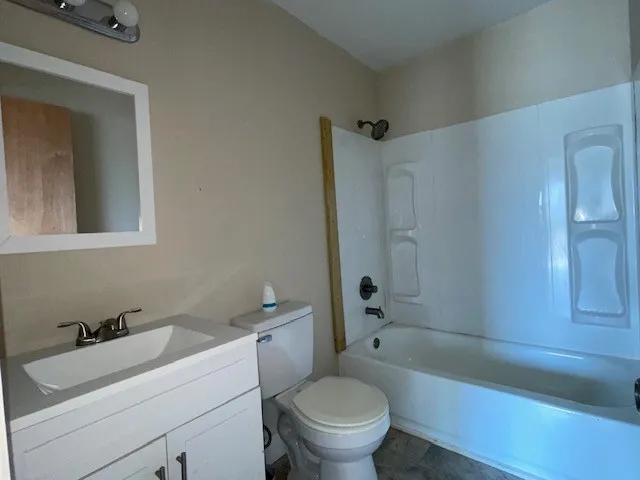 a kitchen with sink a stove and a refrigerator
