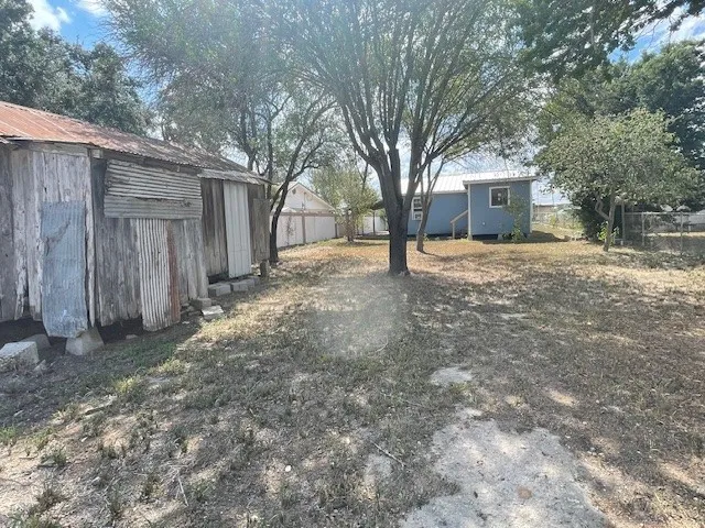 a house with a tree in front of it