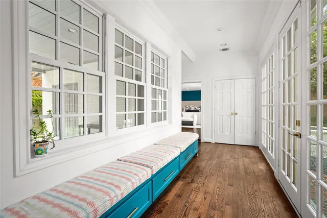 a spacious bedroom with a bed and a window