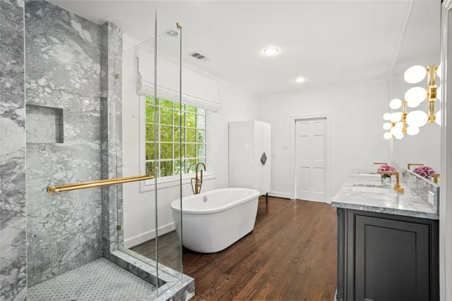 a bathroom with a granite countertop sink mirror and a toilet
