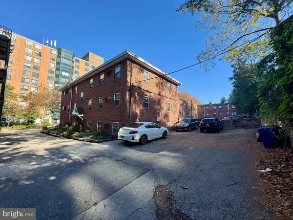 a view of car parked on the side of the road