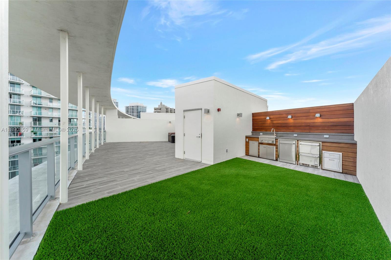 6620 Indian Creek Drive, Unit PH711 Miami Beach, FL 33141 - Photo 2 of 82 a view of a patio with table and chairs and wooden fence
