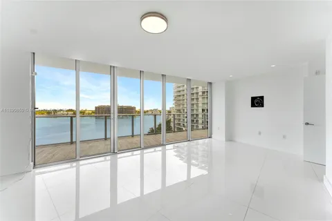 a bathroom with a sink toilet a mirror and shower