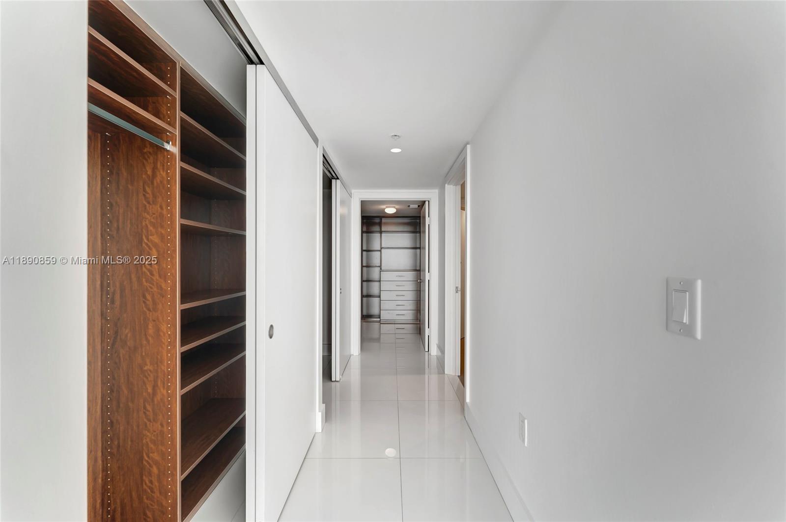6620 Indian Creek Drive, Unit PH711 Miami Beach, FL 33141 - Photo 24 of 82 a view of walk in closet with empty racks