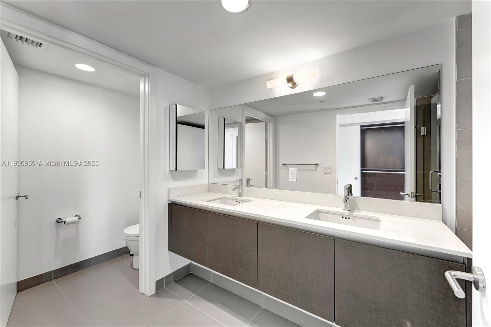 6620 Indian Creek Drive, Unit PH711 Miami Beach, FL 33141 - Photo 27 of 82 a bathroom with a sink double vanity and a mirror