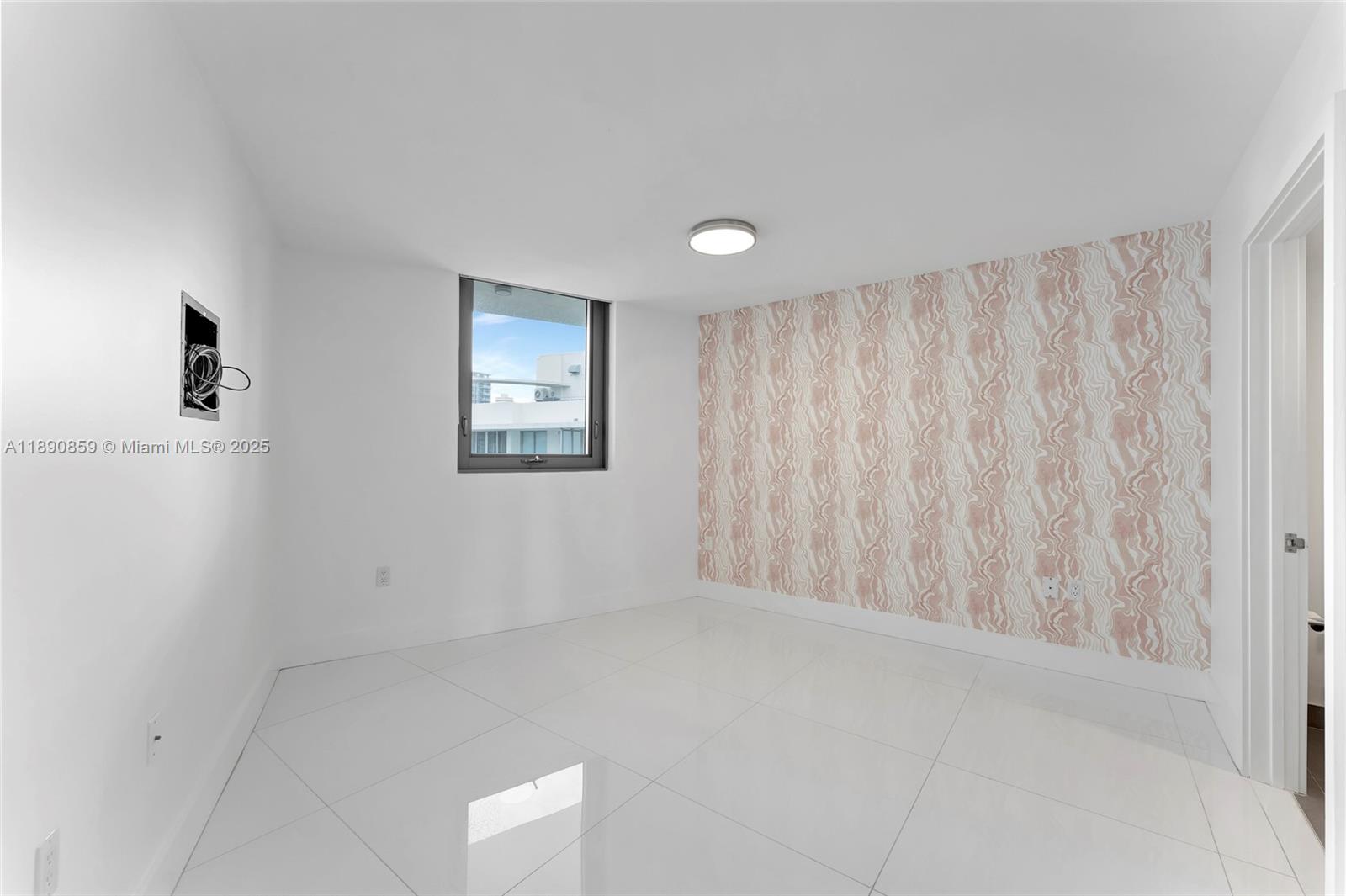 6620 Indian Creek Drive, Unit PH711 Miami Beach, FL 33141 - Photo 32 of 82 a view of an empty room with a window
