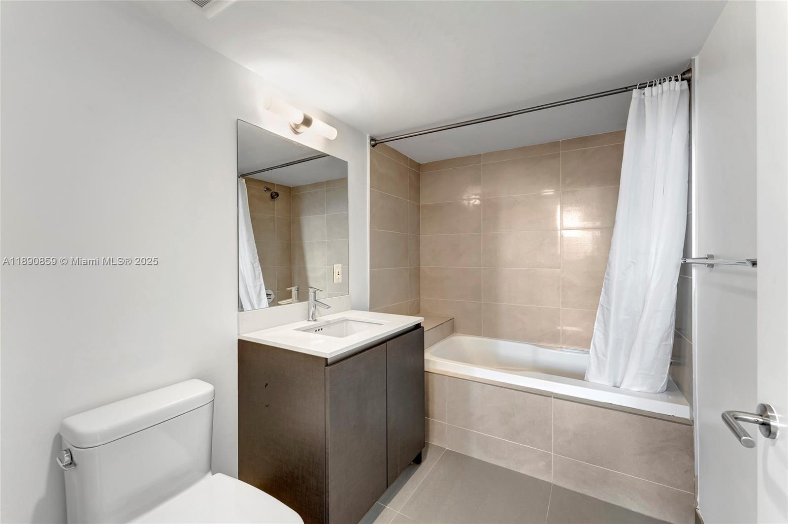 6620 Indian Creek Drive, Unit PH711 Miami Beach, FL 33141 - Photo 35 of 82 a bathroom with a sink a toilet and shower