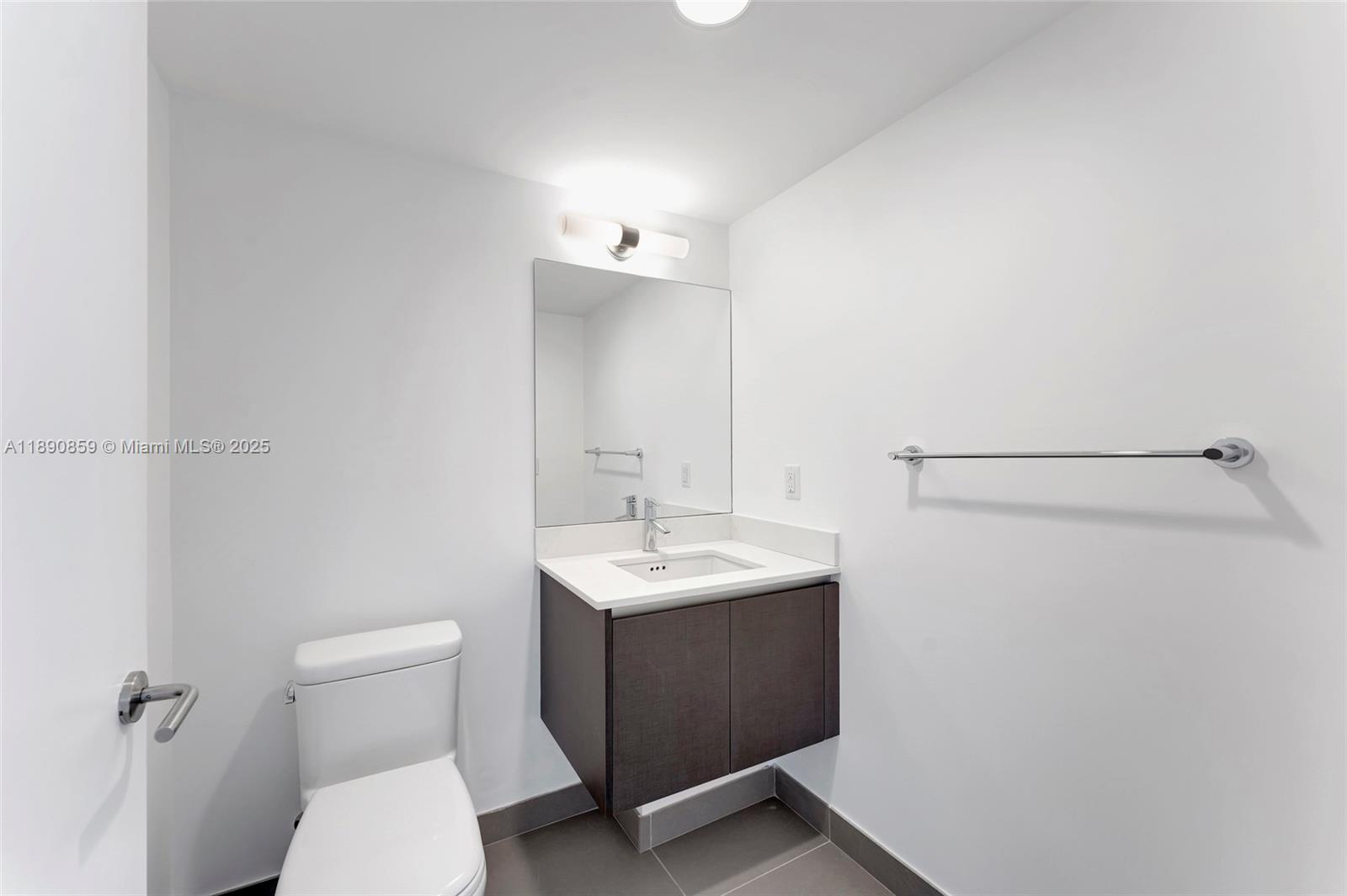 6620 Indian Creek Drive, Unit PH711 Miami Beach, FL 33141 - Photo 36 of 82 a bathroom with a sink toilet and vanity