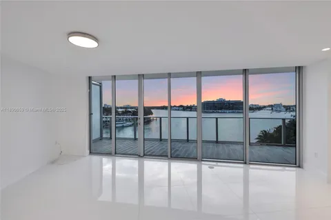 a living room with furniture a rug and a window