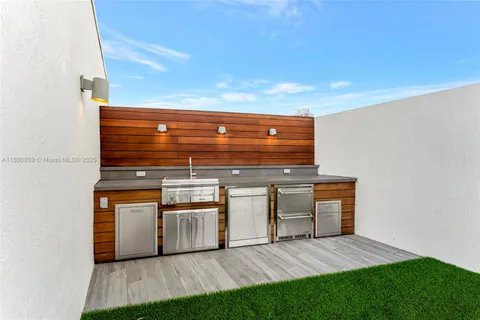 a kitchen with stainless steel appliances a refrigerator and cabinets