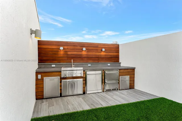 a kitchen with stainless steel appliances a refrigerator and cabinets