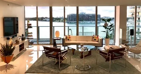 a kitchen with stainless steel appliances a refrigerator and cabinets