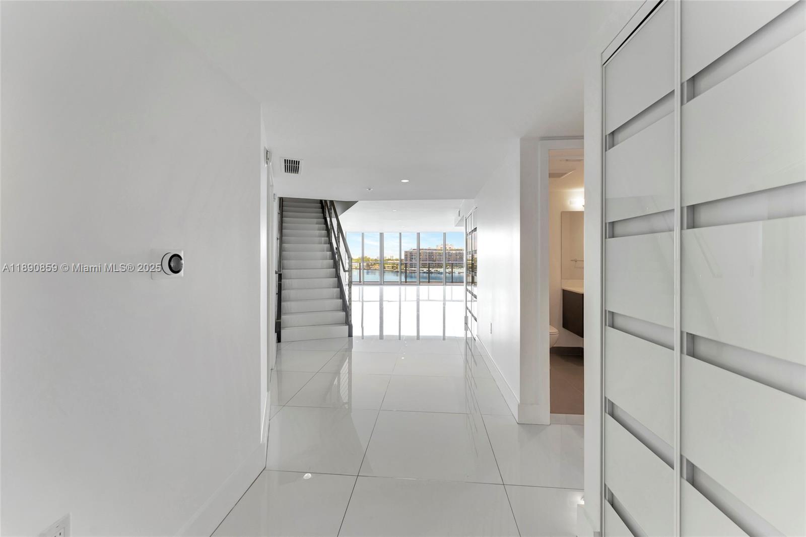 6620 Indian Creek Drive, Unit PH711 Miami Beach, FL 33141 - Photo 6 of 82 a bathroom with a tub and shower