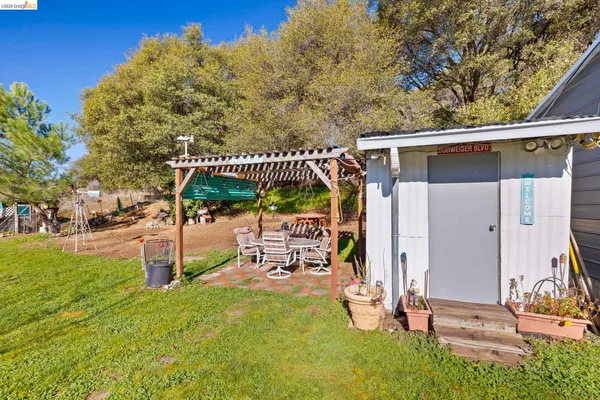 a view of a cars park in front of a house