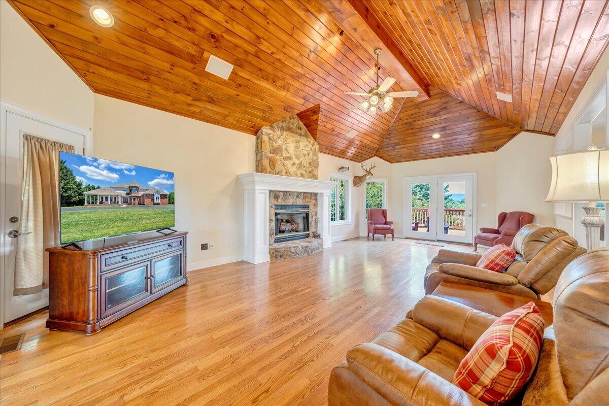 625 Frontier Way Fincastle, VA 24090 - Photo 11 of 105 a living room with furniture and a flat screen tv