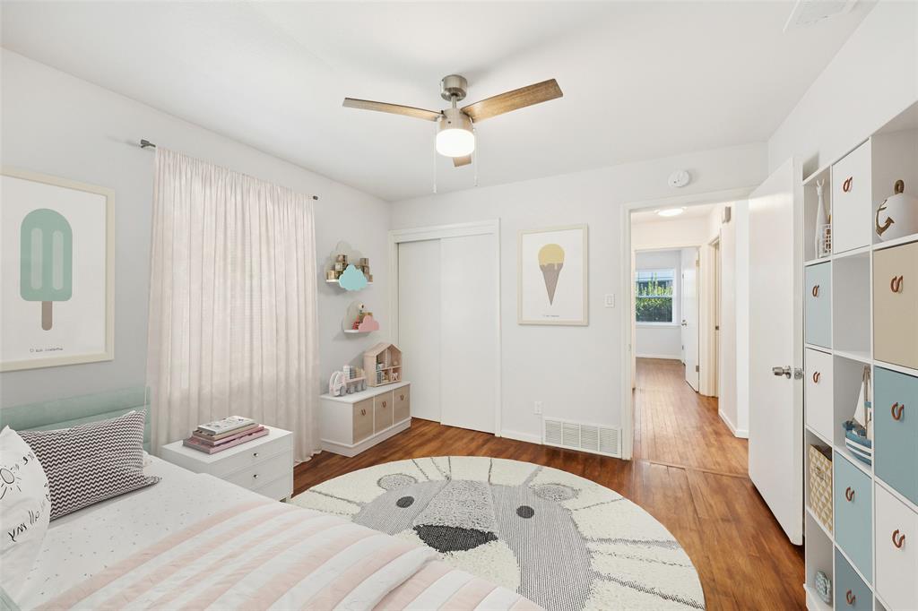 914 Royal Street Forney, TX 75126 - Photo 11 of 28 a bedroom with furniture and a wooden floor