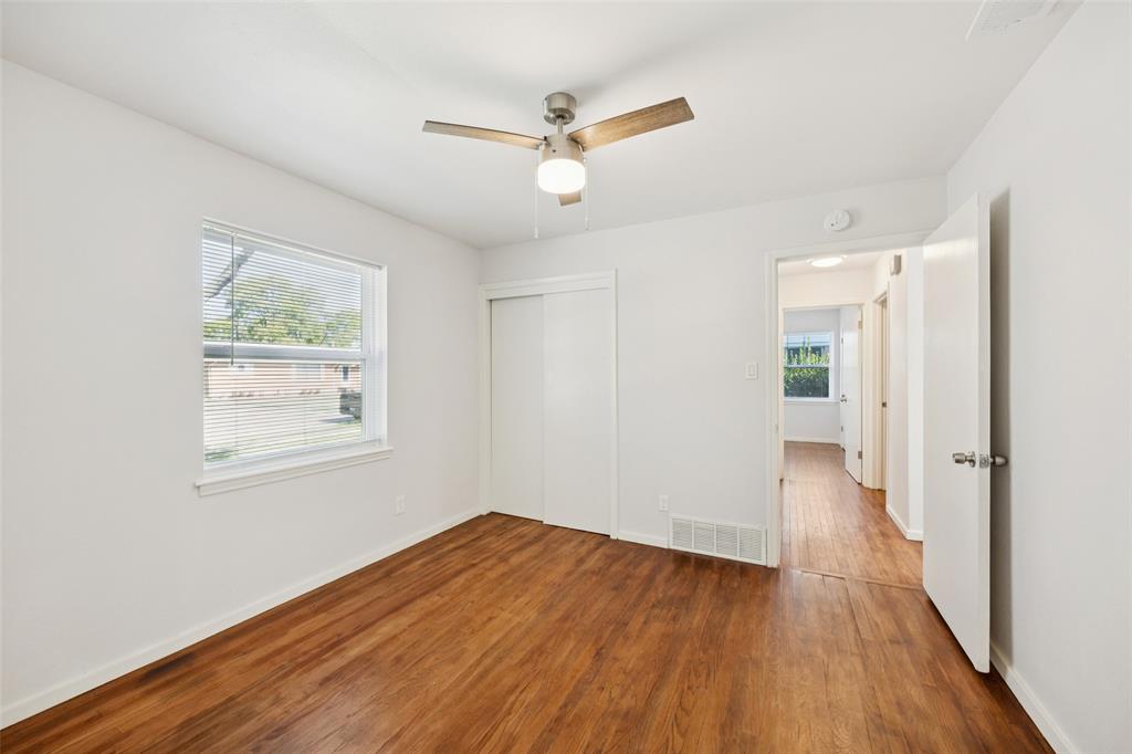 914 Royal Street Forney, TX 75126 - Photo 13 of 28 a view of empty room with wooden floor and fan