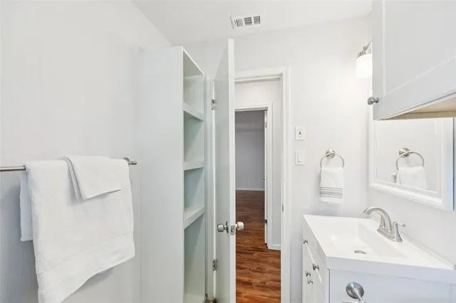 a bathroom with a sink and mirror