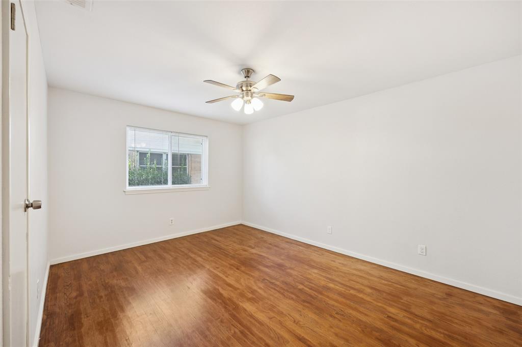 914 Royal Street Forney, TX 75126 - Photo 18 of 28 an empty room with a window and a fan