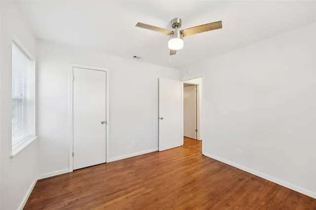 a view of a big room with wooden floor and closet