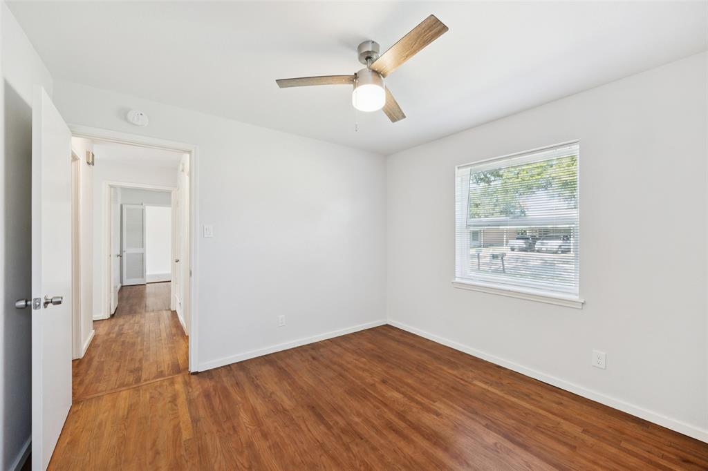 914 Royal Street Forney, TX 75126 - Photo 21 of 28 wooden floor in an empty room with a window